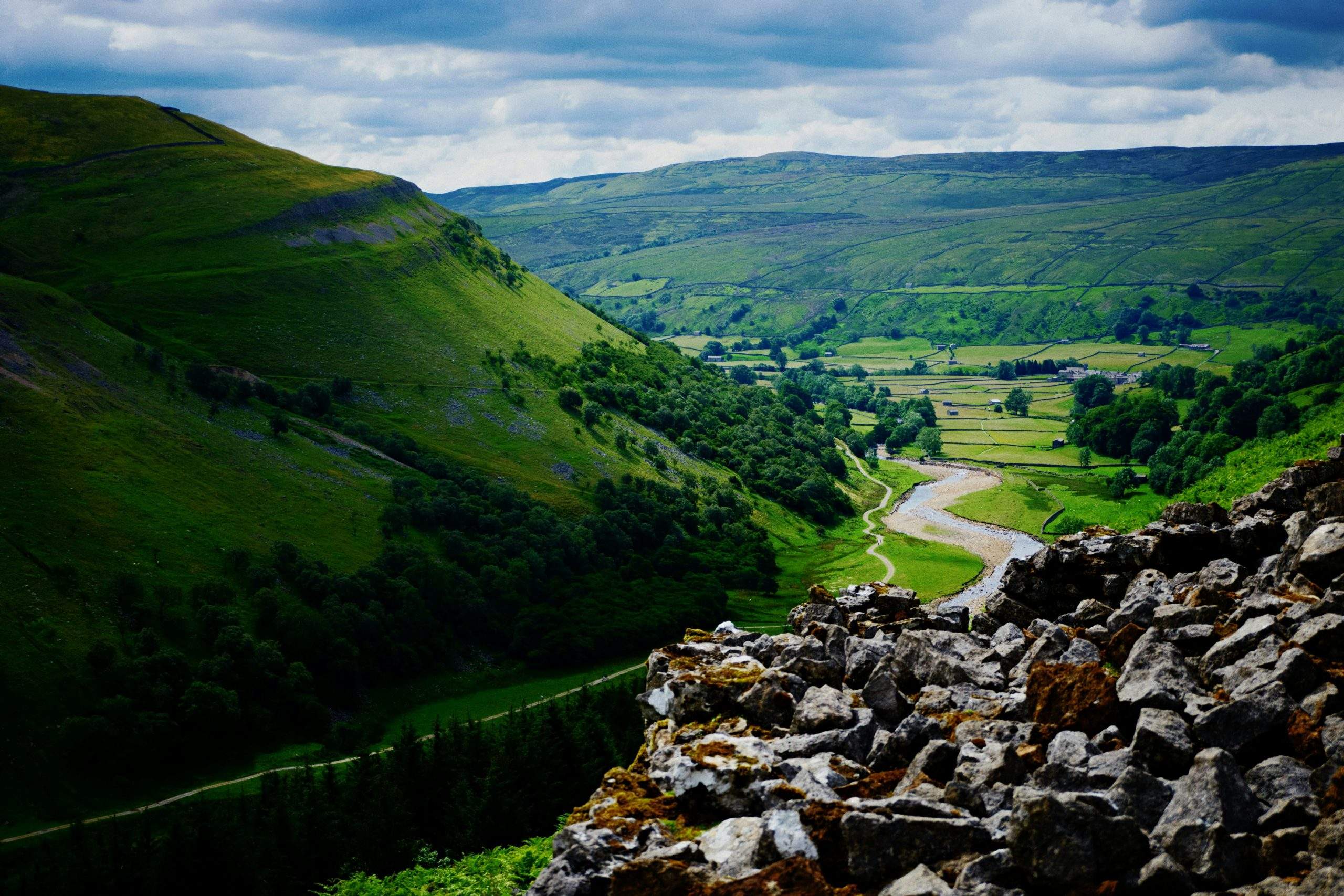 Soft summer light over a Yorkshire Dales valley and fellside